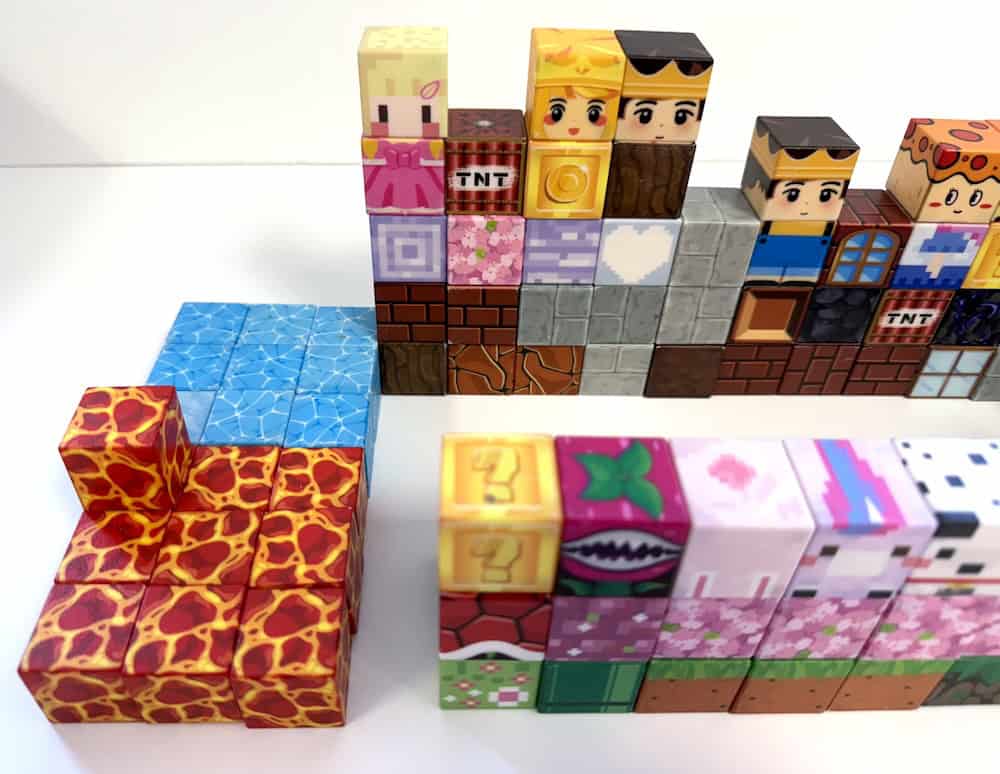 Magnetic Building Blocks are arranged in rows, showcasing various patterns and characters like brick, pizza, and crown designs. Perfect as an Early Finisher Idea to inspire creativity and imagination.