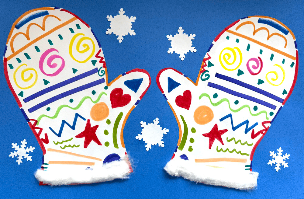 A delightful matching mittens art project features two colorful, decorated paper mittens on a blue background, surrounded by delicate white snowflakes.